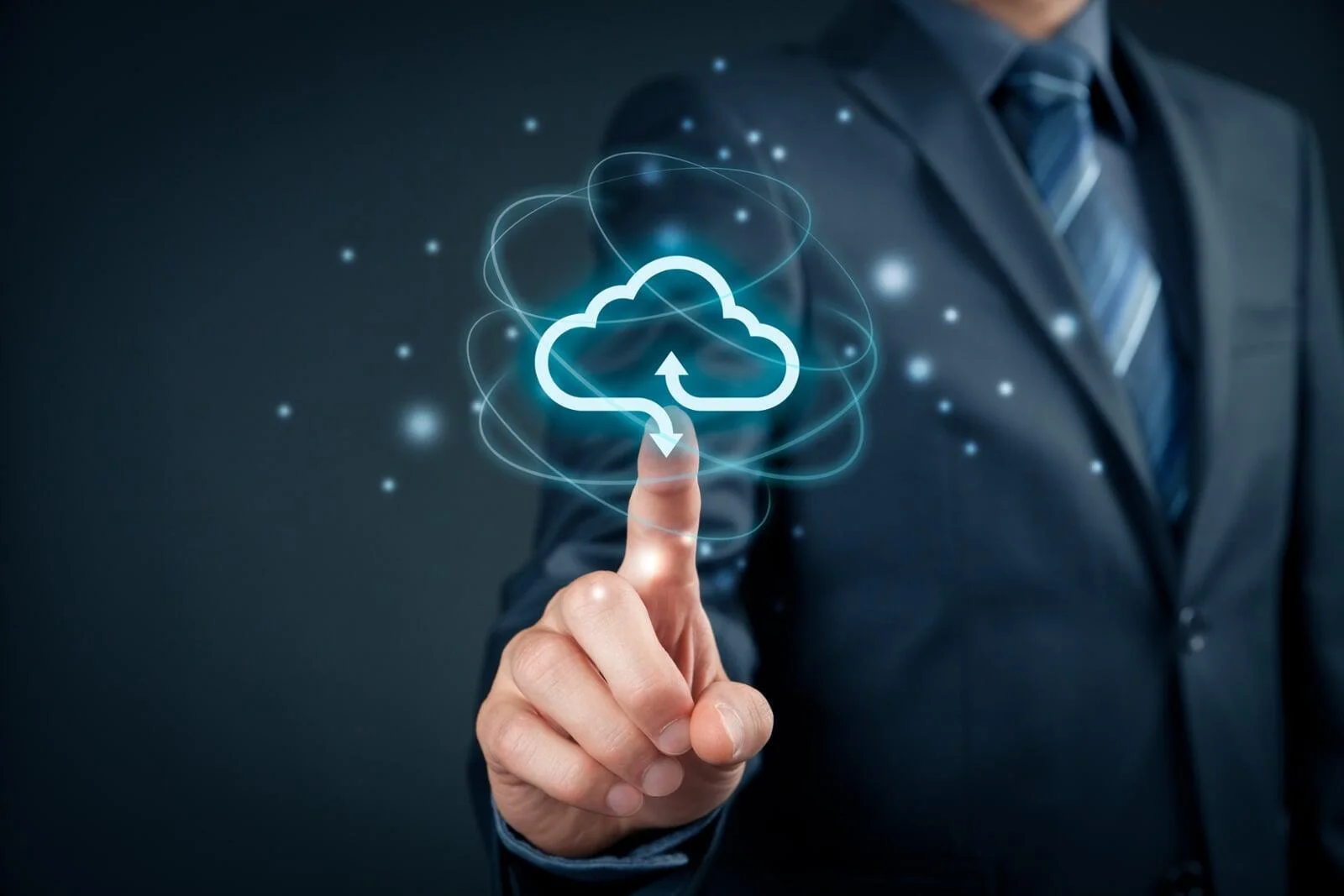 Hand pointing at a glowing cloud icon, symbolizing scalable and reliable Cloud Storage Solutions for Businesses.