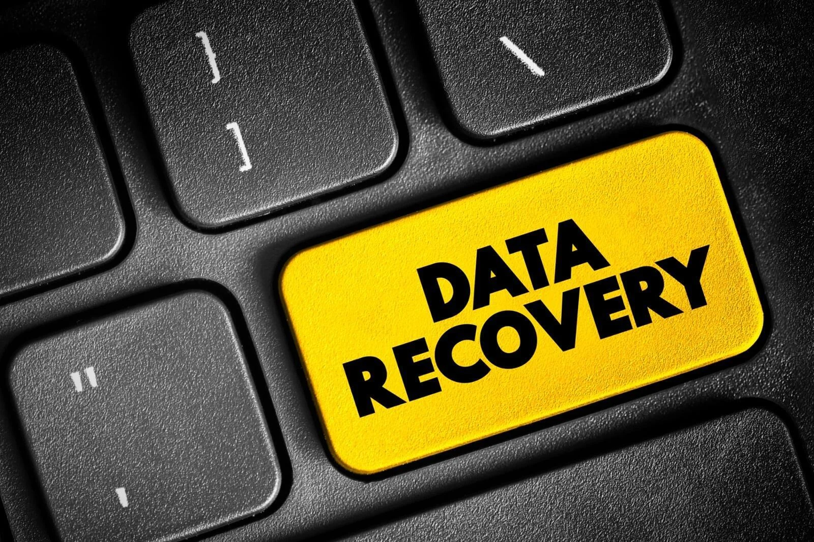 External hard drive connected to a laptop via USB, illustrating a reliable method for how to recover deleted files.