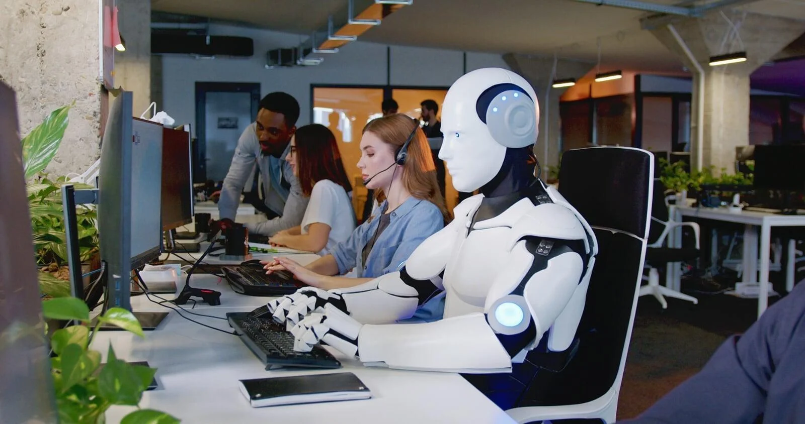 Robot working alongside human staff, symbolizing AI Tools for Office Productivity and task automation.