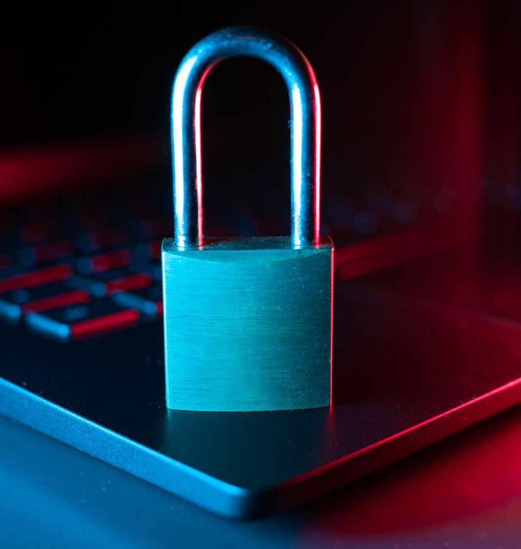 Hand holding a glowing digital shield and lock icon, symbolizing comprehensive Remote Work Security Solutions for Small Business.