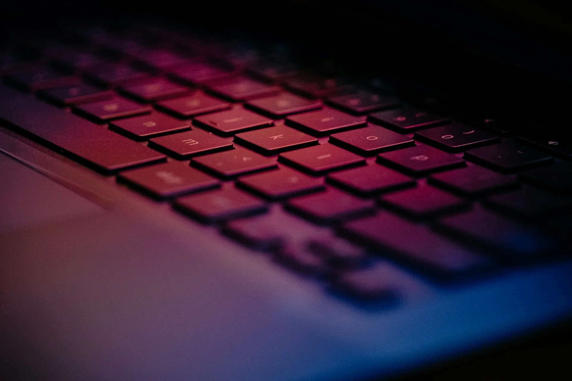 A side-profile view of a sleek laptop on a desk, illustrating a common device that requires professional IT Asset Disposition (ITAD).